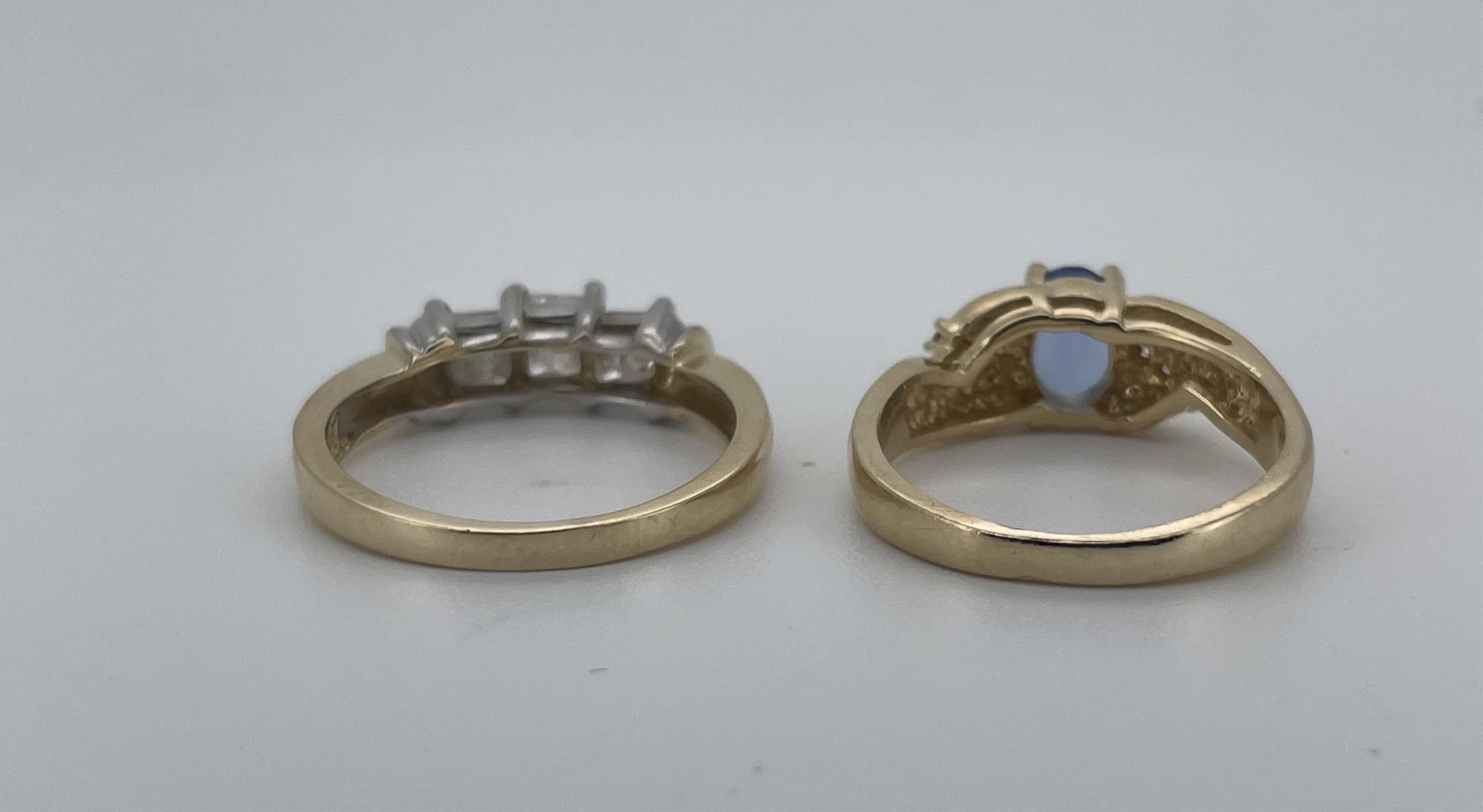 A modern 14ct gold and three stone Princess cut diamond set ring, size N, together with a 14k yellow metal and single stone oval cut tanzanite ring, with six stone diamond chip set shoulders, size M, gross weight 6.5 gra